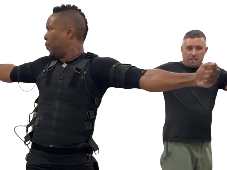 Client training with EMS suit and coach at Surge Lab Jersey City studio.