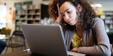 A woman stressfully working