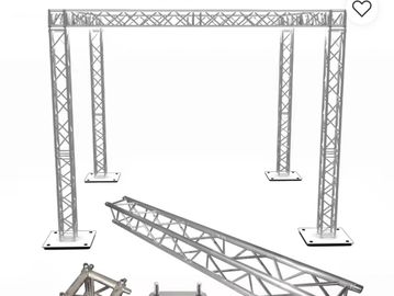 Metal truss system with four vertical supports and connecting horizontal beams.
