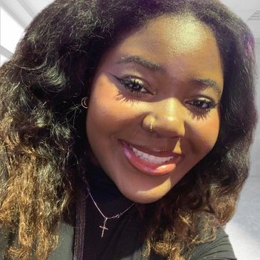 Photo of Krisy - Black woman smiling