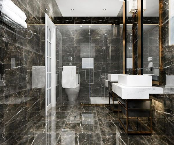 Luxurious black marble tiled bathroom.