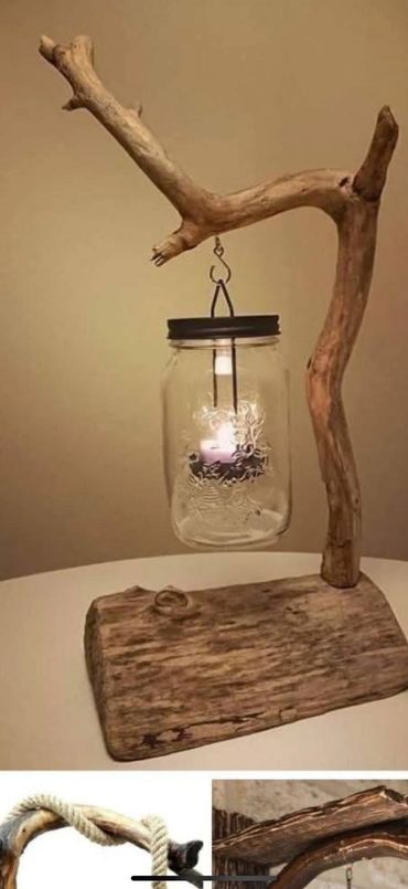 Rustic candle holder made from a wooden branch and a glass jar.
