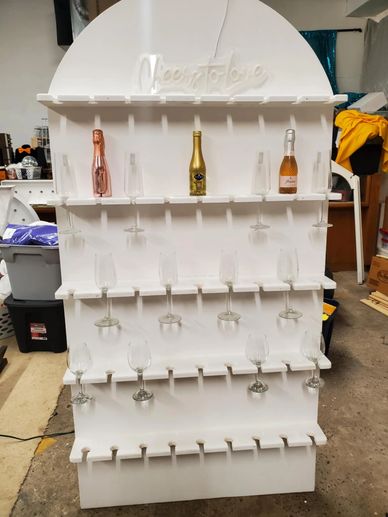 Champagne walls serve as an interactive focal point, guests help themselves to a celebratory toast