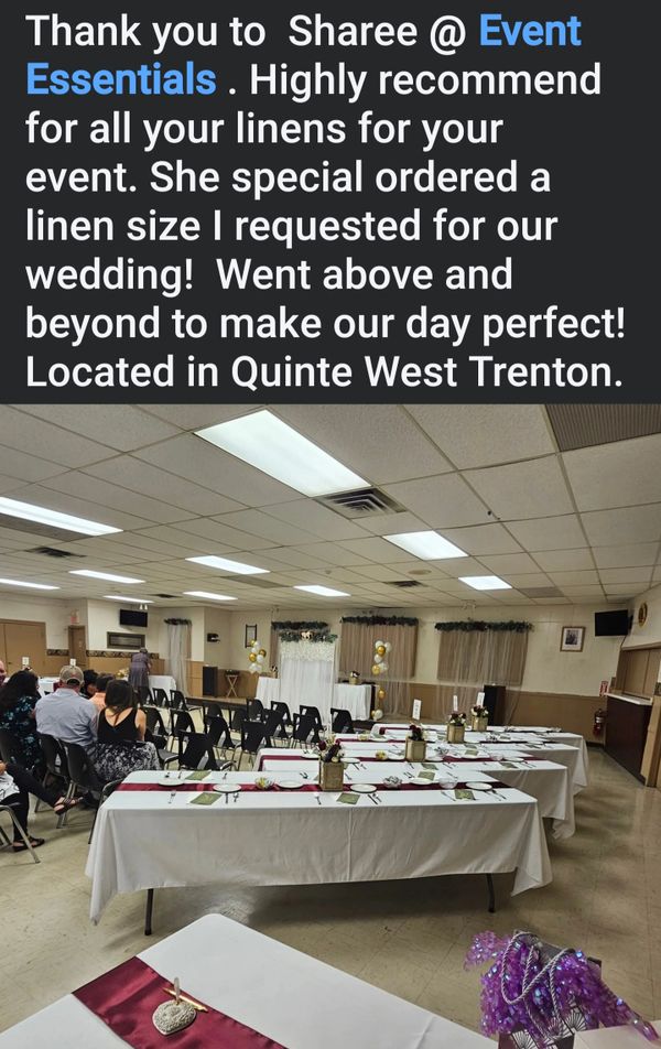 Wedding event setup with elegant linens and decorations in a hall.