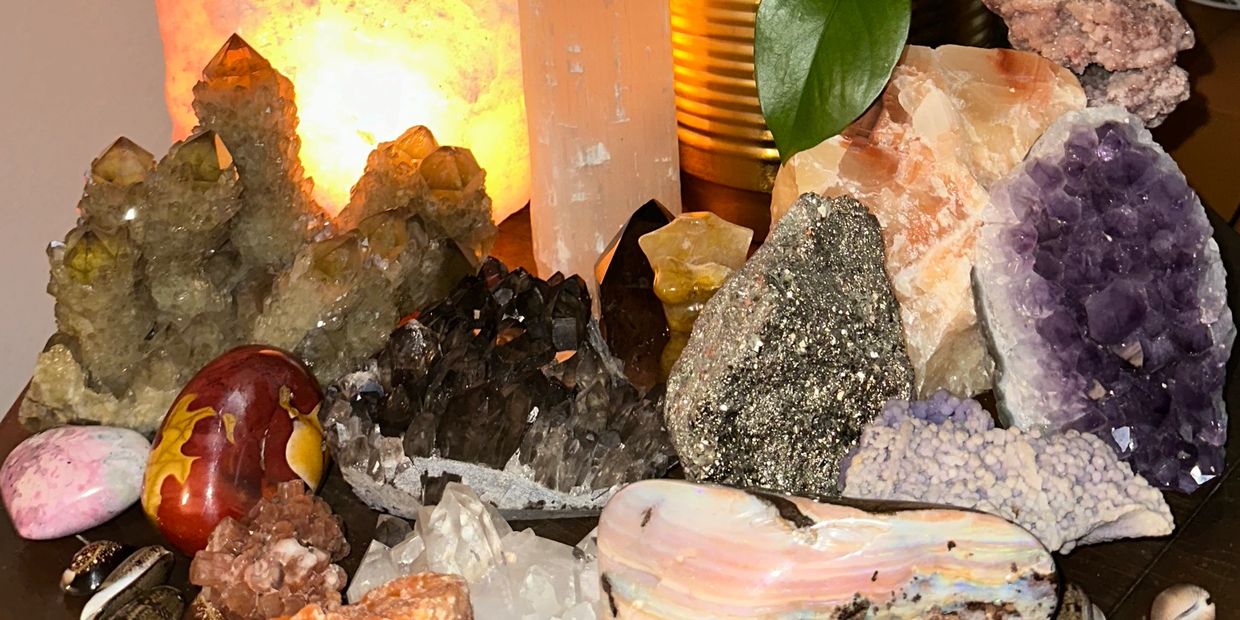 Crystals like citrine opal jasper amethyst pyrite clear quartz and salt lamp 