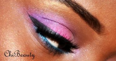 A picture of an eye with purple pink and blue makeup bu ChiBeauty Studios for a wedding