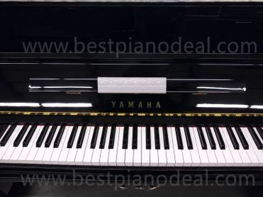 Close-up of Yamaha piano keys.