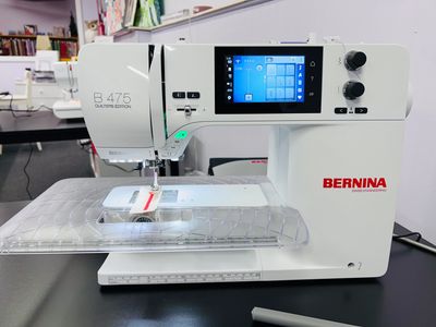 BERNINA Sewing Machine sitting on a table sewing