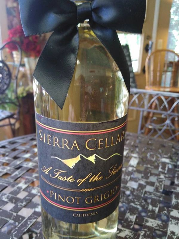 Bottle of Sierra Cellars Pinot Grigio wine with a black bow.