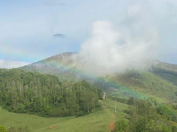Rainbow over the Mountain Top Cabin at Rugby Creek with Grayson Highlands State Park as the backdrop