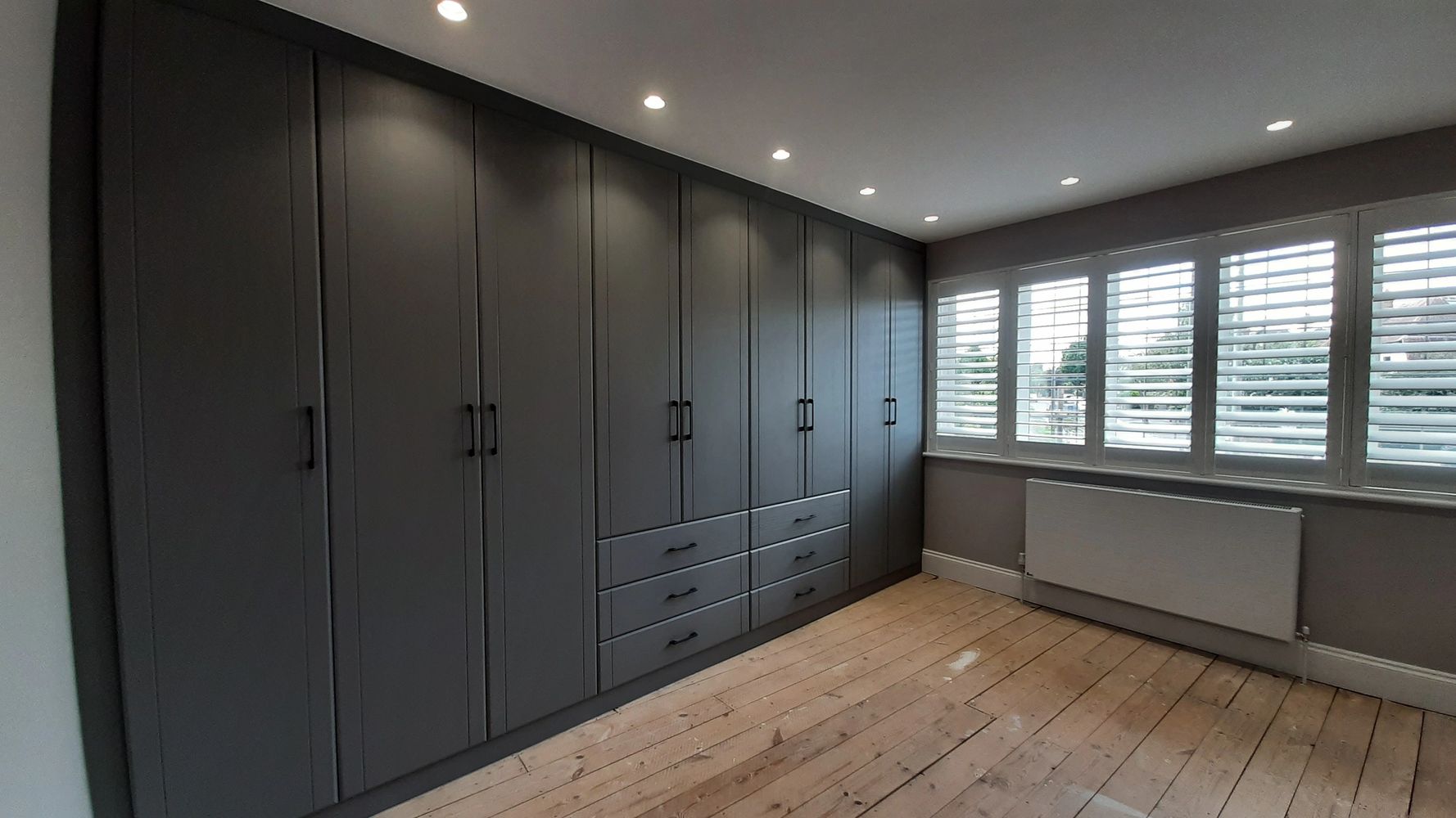 Corner view of black shelves furniture in a house