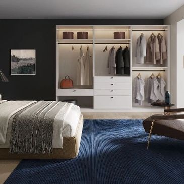 deluxe bedroom with open concept and new closet with lighting