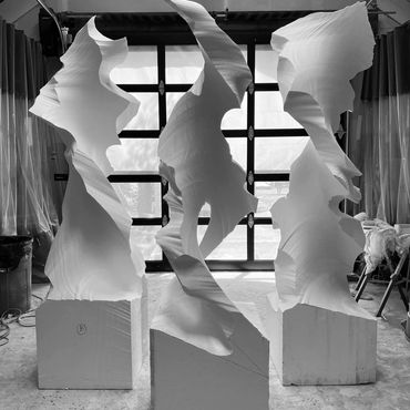 3 Twisted slab sculptures carved out of EPS foam, the precursor to fiberglass work, by David Kujda.