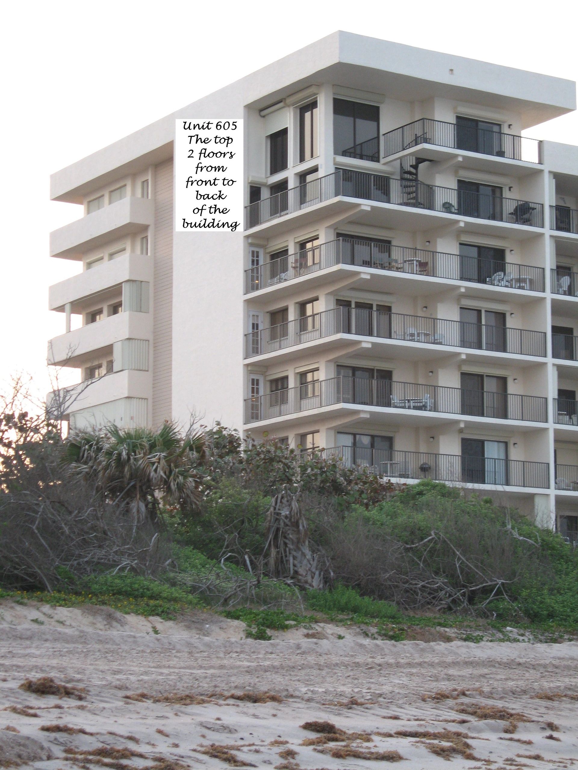 building_from_beach_with_text.jpg