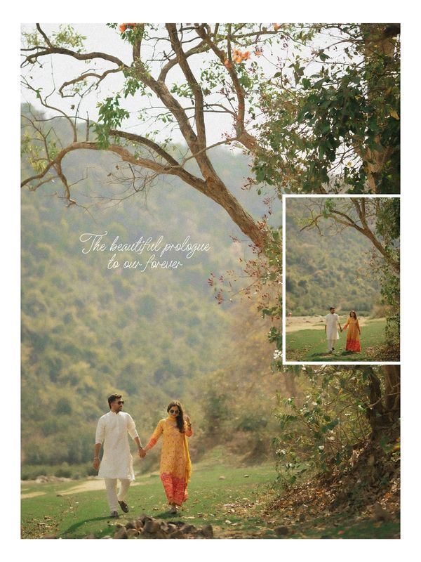 A couple holding hands walking in nature under a tree.