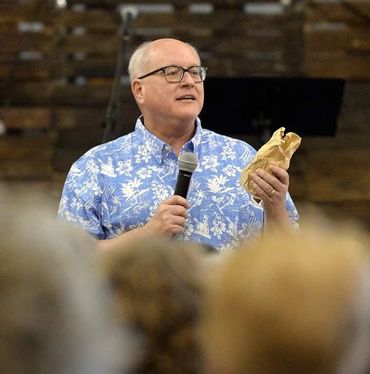 Pastor preaching Bible