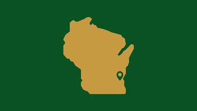 Outline of the state of Wisconsin with a geolocation pin marking Milwaukee
