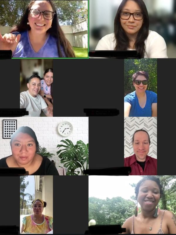 Group video call with smiling participants in various locations.