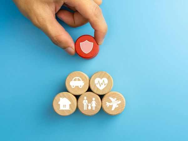 The concept of insurance. Wooden blocks with insurance icons