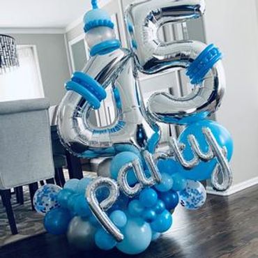A picture of blue and silver color themed balloons