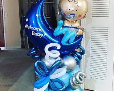 A picture of welcome baby boy theme balloons
