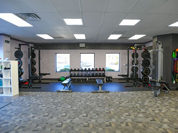 Main Line Personal Training Studio in Bryn Mawr, with squat racks, dumbbells, and an open workou
