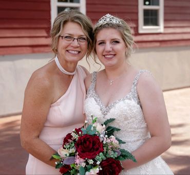 A Women, who had a Galen Malformation (VOGM, VGM) on her wedding day with her mother.