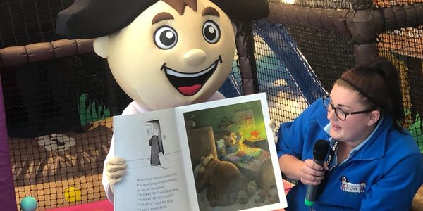 Mascot George taking part in our community story time at kassiopi cove