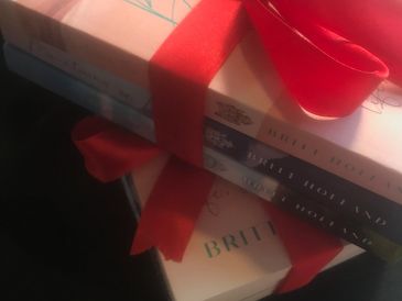 Britt Holland's giftset trilogy books, Between the Sheets, Mountains of Love, Forever Connected