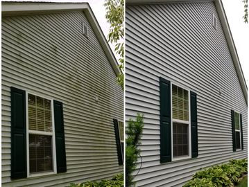 Before and after pictures of cleaned vinyl siding using our soft washing method to remove algae 