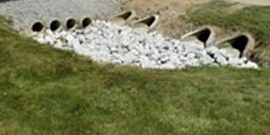 Snowball Excavating - Open Ditch Storm Water Drain with Rip Rap Rock