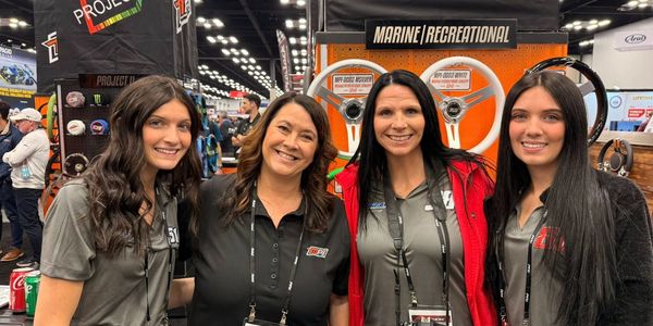 Female-led Michigan motorsports marketing team with MPI at the PRI Show industry event.