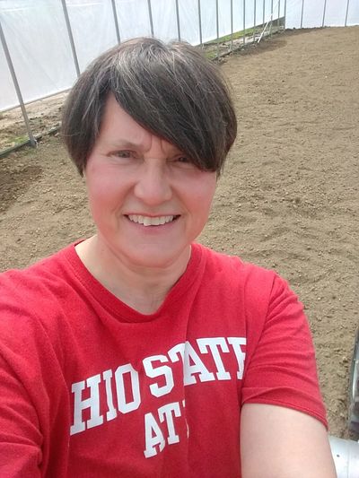 Close up of Marqua Myers, a light-skinned woman, with short hair and red "Ohio State" shirt.