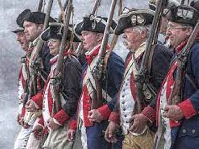 Soldiers in historic American Revolutionary War uniforms with muskets.