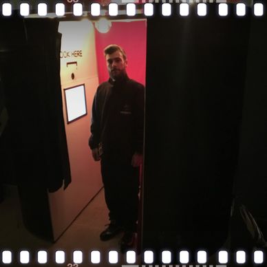 enclosed photo booth with photo booth attendant