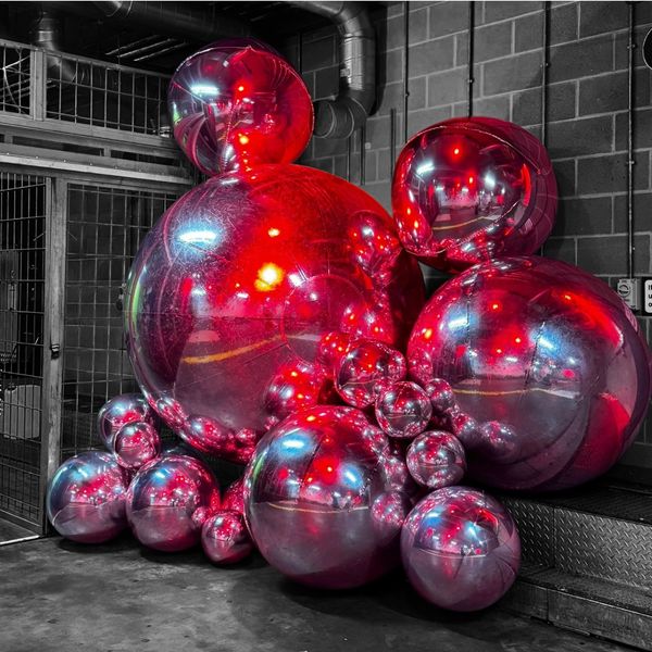 Cluster of Giant chrome balloon orb hire london