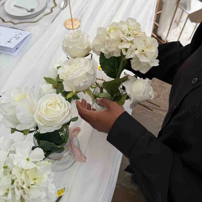 hands fixing a flower bouquet