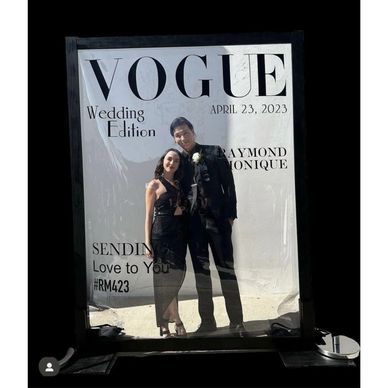 couple posing using a magazine photo booth