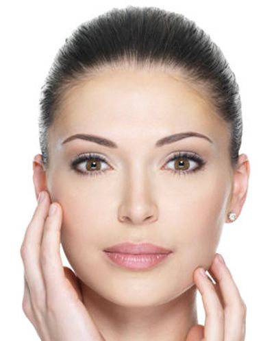 Woman waving her hand over her face and looking ahead