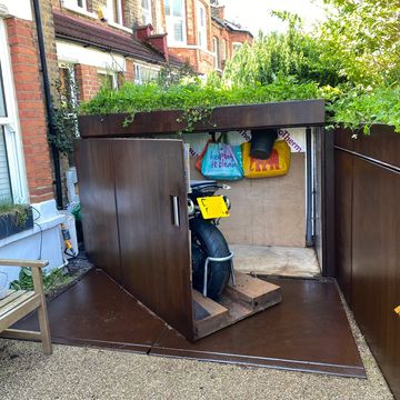 Motorcycle storage box - Motobox on pivot door access in the front garden
