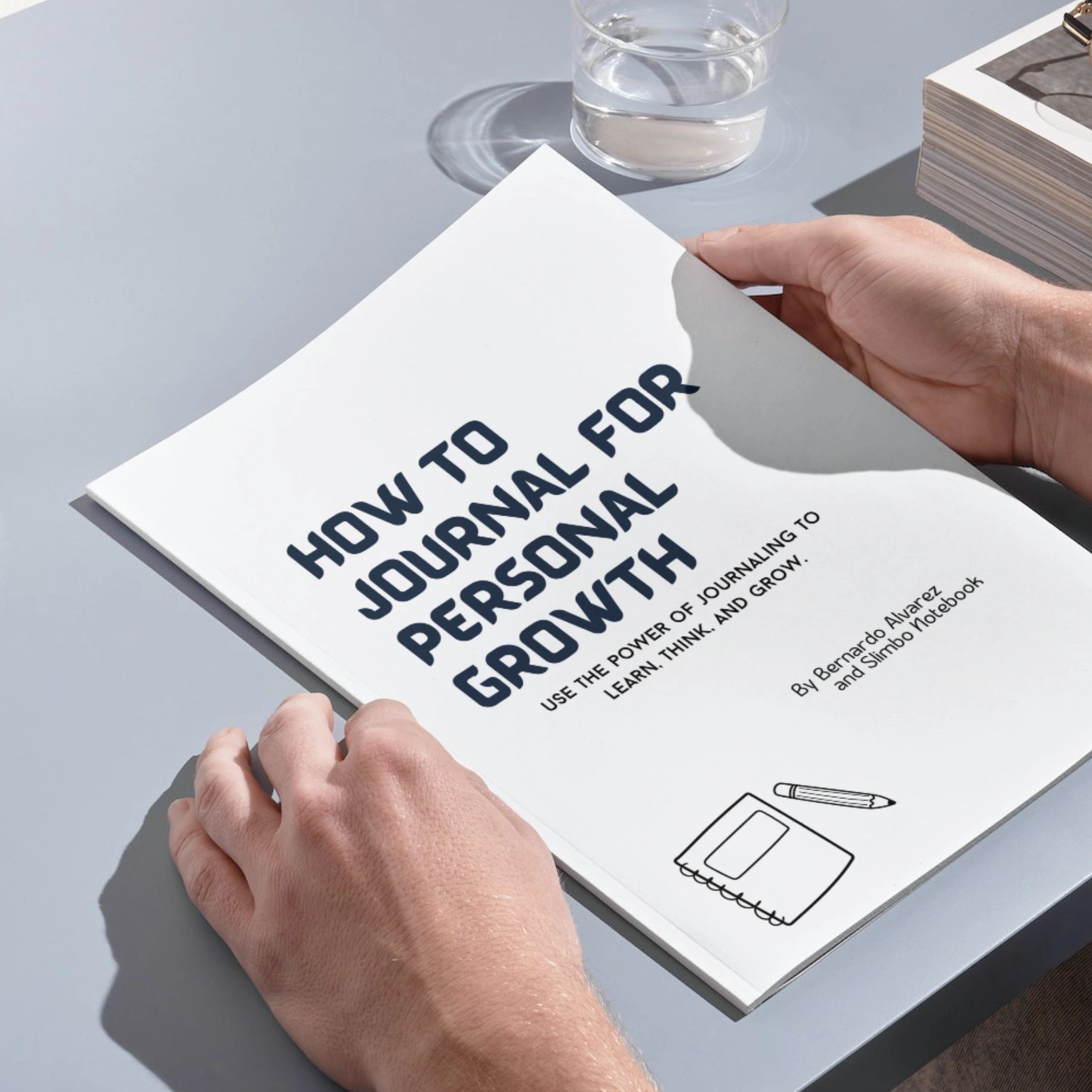 Person holding a book about personal growth journaling.