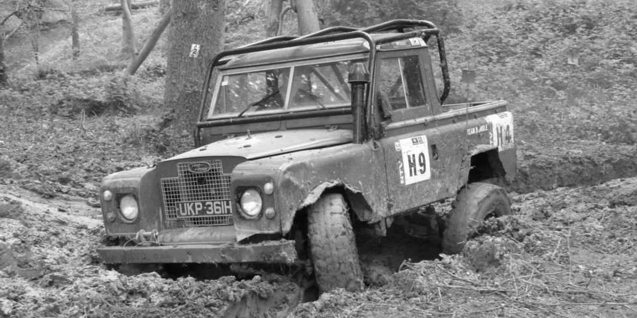 Landrover 4x4 off roading in the mud with roll cage lift kit snorkel and winch 