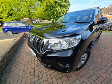 Front 3/4 of black Toyota Land Cruiser polished to gloss by AM Auto Aesthetics
