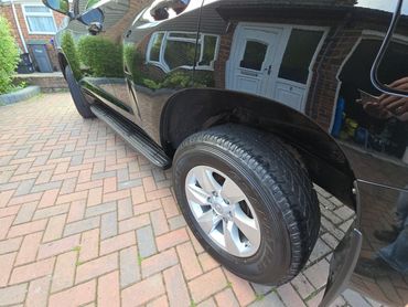 Rear 3/4 of black Toyota Land Cruiser polished and detailed by AM Auto Aesthetics