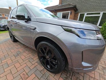 Front 3/4 of grey Range Rover Discovery with restored shine after valet by AM Auto Aesthetics