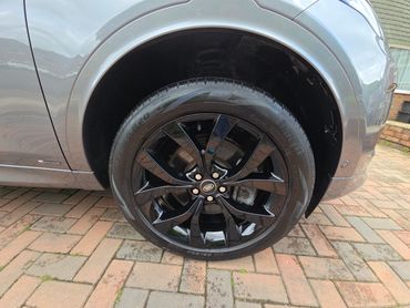 Wheel and caliper of grey Range Rover Discovery Evoque cleaned by AM Auto Aesthetics