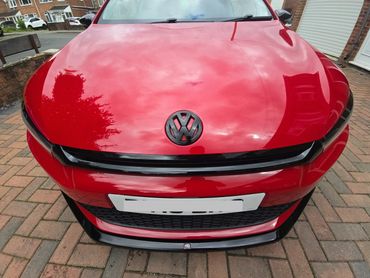 Front of red Volkswagen Scirocco showing gloss after polish by AM Auto Aesthetics
