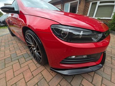 Front 3/4 of red Volkswagen Scirocco with restored shine after valet by AM Auto Aesthetics