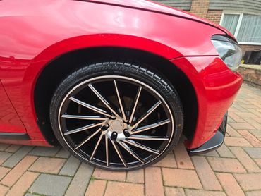 Wheel and caliper of red Volkswagen Scirocco cleaned by AM Auto Aesthetics
