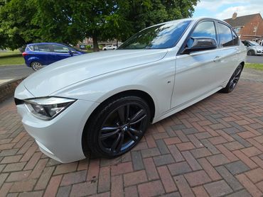 Front 3/4 of white BMW 320 polished to gloss by AM Auto Aesthetics